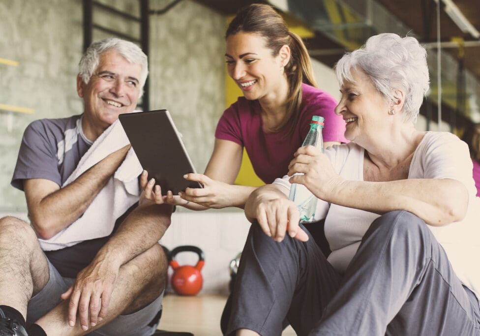 senior-couple-in-rehabilitation-center-personal-trainer-showing-on-picture-id687030820 senior-couple-in-rehabilitation-center-personal-trainer-showing-on-picture-id687030820